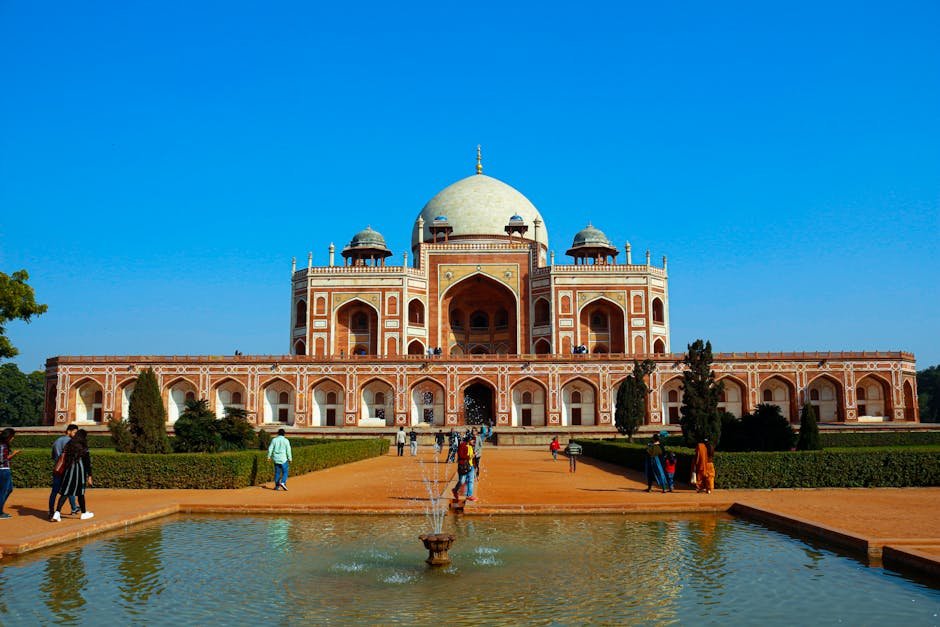 Explore the grandeur of Humayun's Tomb in New Delhi, India, on a bright day with visitors.